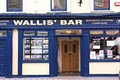 Wallis' Town Hall Bar logo